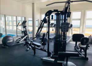 a gym with several treadmills and exercise bikes at Château Madelinot in Fatima