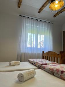 Postel nebo postele na pokoji v ubytování Apartmani Subotic