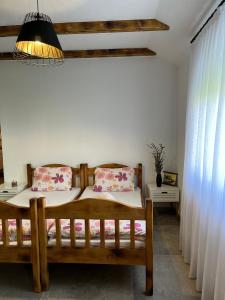 Postel nebo postele na pokoji v ubytování Apartmani Subotic