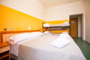 Postel nebo postele na pokoji v ubytování Hotel Montebello Riccione