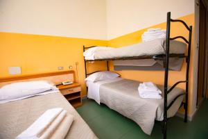 Postel nebo postele na pokoji v ubytování Hotel Montebello Riccione