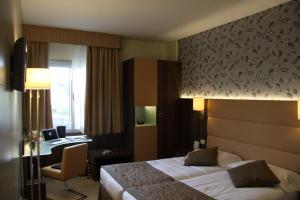Posteľ alebo postele v izbe v ubytovaní LH Hotel Sirio Venice