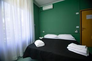 Postel nebo postele na pokoji v ubytování Hotel Montebello Riccione
