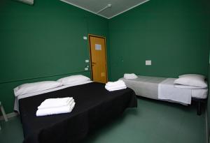 Postel nebo postele na pokoji v ubytování Hotel Montebello Riccione