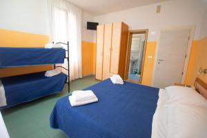 Postel nebo postele na pokoji v ubytování Hotel Montebello Riccione