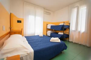 Postel nebo postele na pokoji v ubytování Hotel Montebello Riccione