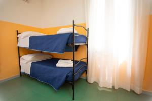 Postel nebo postele na pokoji v ubytování Hotel Montebello Riccione