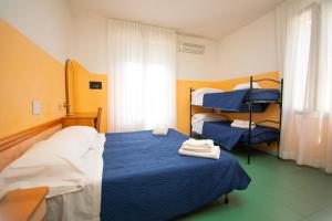 Postel nebo postele na pokoji v ubytování Hotel Montebello Riccione