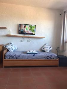 Postel nebo postele na pokoji v ubytování Bilocale costa smeralda località cugnana verde