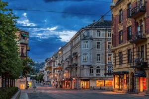 a city street with buildings on a street at Super-central and attractive Apartment in Oslo