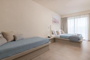 Postel nebo postele na pokoji v ubytování Olive Garden Hotel