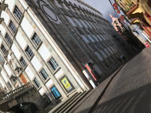 a building with a clock on the side of it at Casa Caracol Guanajuato in Guanajuato