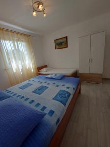 Postel nebo postele na pokoji v ubytování Apartment Ante