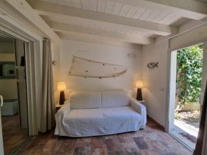 a bedroom with a bed in a room with a window at Lulamax Sardegna Olbia in Olbia