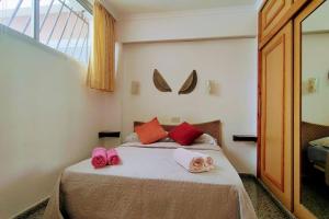 A bed or beds in a room at Acogedor Atlantis
