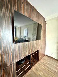 Televízia a/alebo spoločenská miestnosť v ubytovaní Comfort Apartment 2 rooms 65m2