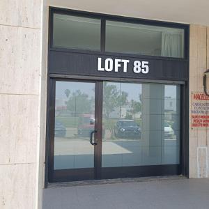 a store front with a sign that reads left at LOFT 85 in Baia Verde