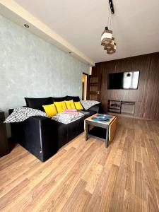 Televízia a/alebo spoločenská miestnosť v ubytovaní Comfort Apartment 2 rooms 65m2
