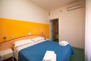 Postel nebo postele na pokoji v ubytování Hotel Montebello Riccione