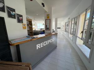 a hallway of a restaurant with a reception counter at Apartaments Monjardí in Lloret de Mar +132 photos