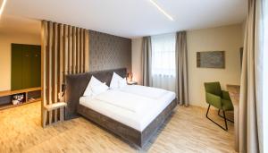 Rúm í herbergi á Hotel Himmelreich