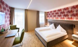 Rúm í herbergi á Hotel Himmelreich