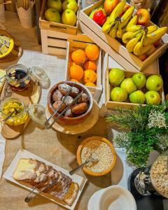 a table topped with lots of different types of food at Etno Garden Apartments in Plitvička Jezera