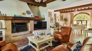 a living room with a couch and a fireplace at San Martino in Certaldo