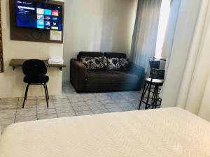 TV a/nebo společenská místnost v ubytování Hotel de Minas
