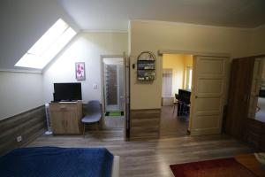 TV a/nebo společenská místnost v ubytování Fónagy Apartmanok
