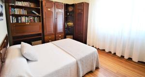 Postel nebo postele na pokoji v ubytování Piso de playa con terraza en el centro de Vilanova