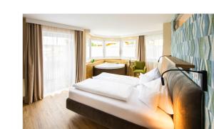 Rúm í herbergi á Hotel Himmelreich