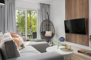 TV a/nebo společenská místnost v ubytování Porta Mare Apartments LuxView III