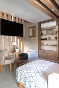 Кровать или кровати в номере MARCOLINI - Villa Barto Leblon