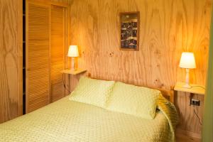 Postel nebo postele na pokoji v ubytování Del Pescador Hotel Cabañas