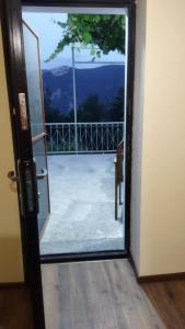 an open door with a view of a balcony at Arman Bed and Breakfast in Halidzor