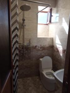 a bathroom with a toilet and a sink at Arman Bed and Breakfast in Halidzor