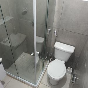 a bathroom with a shower and a toilet and a sink at Pousada Marduk excelente localização suites simples Dispensamos hóspedes exigentes in Teresópolis
