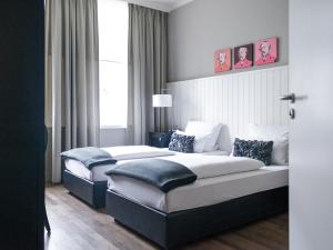 Cama ou camas em um quarto em Hotel Victoria