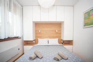 Un pat sau paturi într-o cameră la Vila Zlatibor Home & Spa