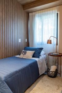 Кровать или кровати в номере MARCOLINI - Villa Barto Leblon