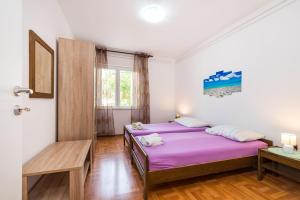 Postel nebo postele na pokoji v ubytování Cozy Apartment Branka with nice Garden