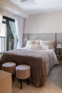 Кровать или кровати в номере MARCOLINI - Villa Barto Leblon