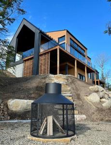 a house sitting on top of a hill at L'Auguste - Luxe et confort in Petite-Rivière-Saint-François