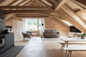 a living room with a couch and a table at Haus Hof 30 in Schwarzenberg