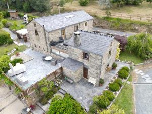 an aerial view of a large stone house at Casa Piñeiro in Monfero