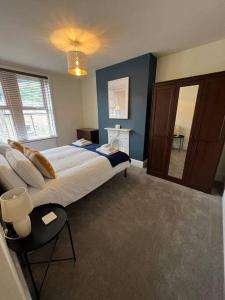 a bedroom with a large bed and a large window at Gorgeous home in Hebden Bridge in Hebden Bridge