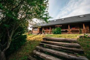 a stairway leading to a log cabin at Bieszczadzka Bania in Lesko