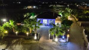 an overhead view of a house at night with lights at Lovos House in Laganas