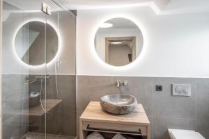 a bathroom with a sink and a mirror at Langwieder See in Munich